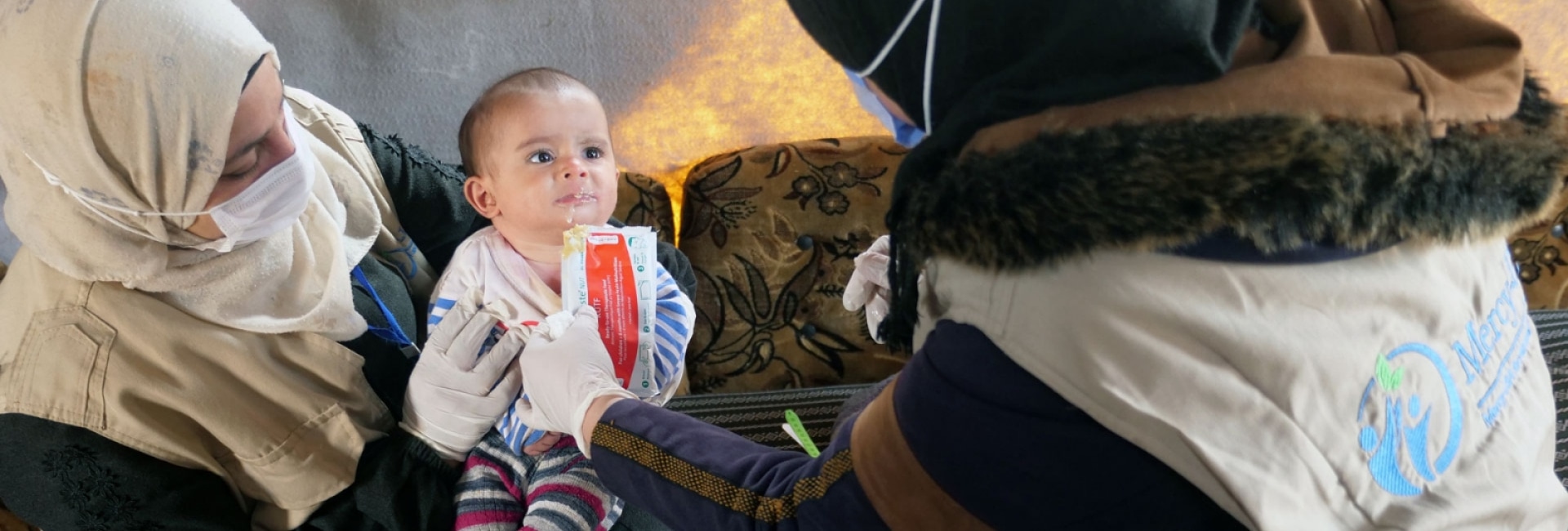 Providing nutrition to an infant in a war camp